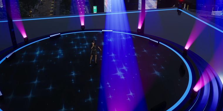 The same stage lit in blue and violet